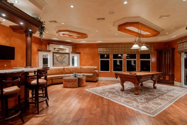 light wooden room, with brown furniture and a beige carpet on a brown laminate floor