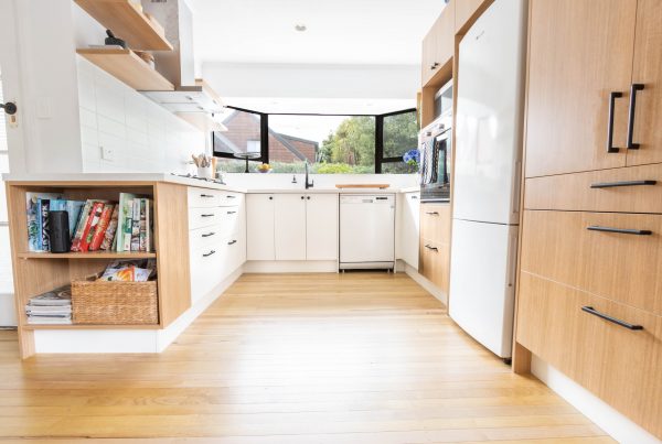 light wooden kitchen floor with white countertops